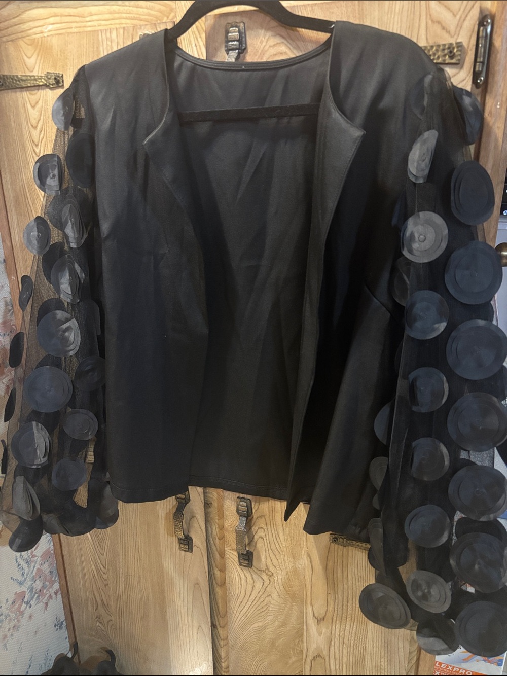 Black open front blouse with 3d circles on sleeves sheer material size L